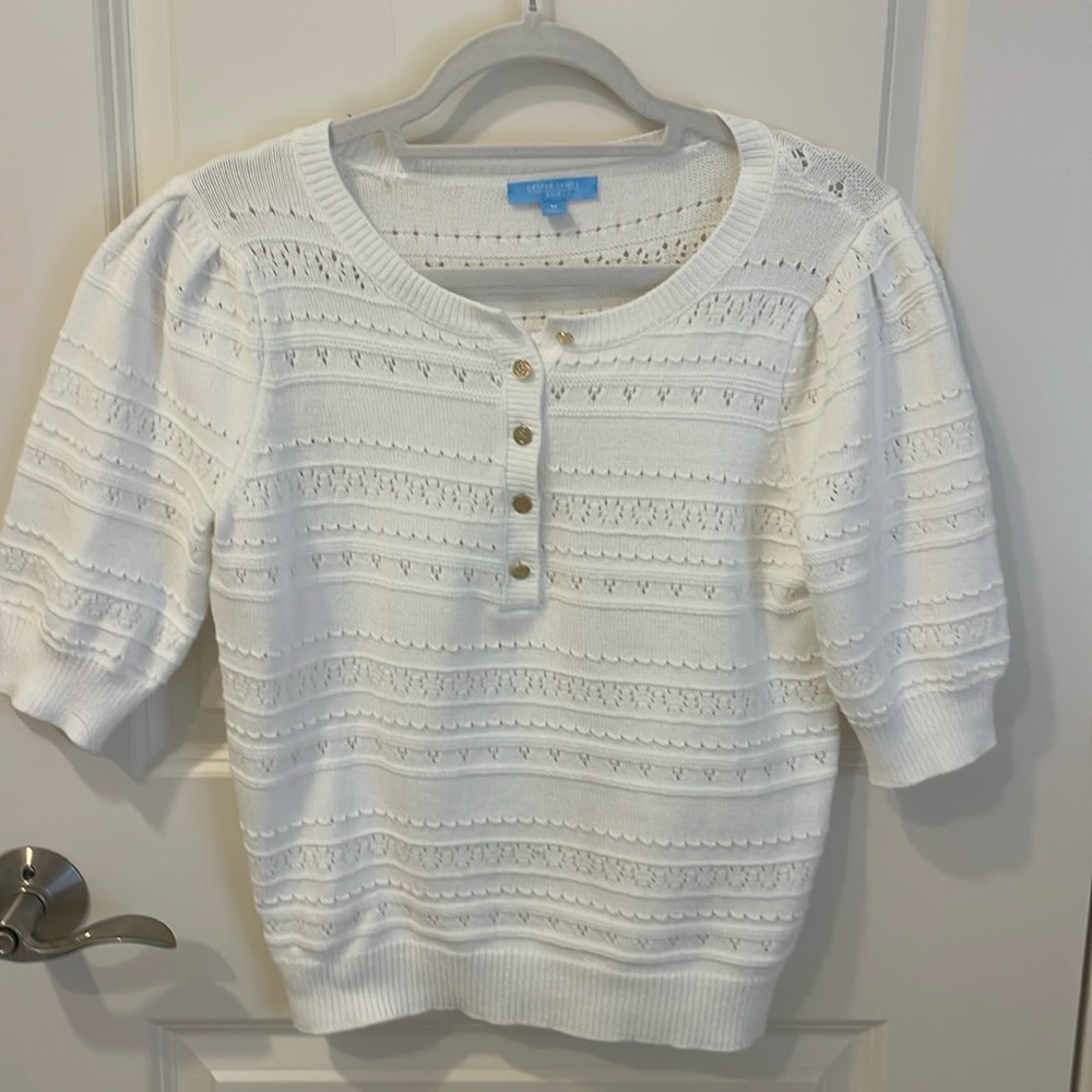 White mid sleeved sweater with gold buttons
